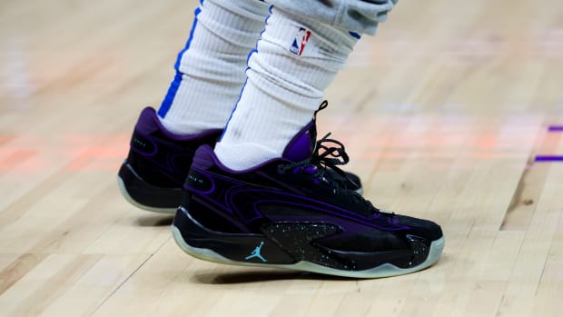 View of Luka Doncic's black and purple Jordan Brand shoes.